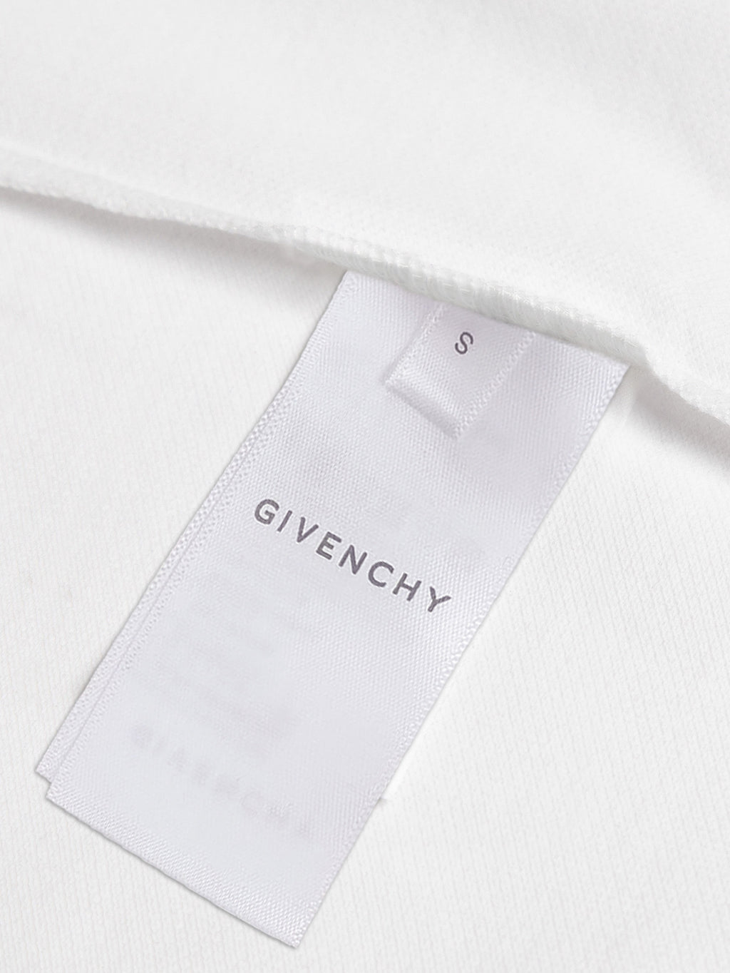 White polo shirt interior with Givenchy size label