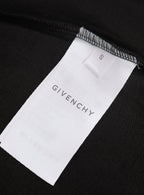 White size label marked S on black polo shirt