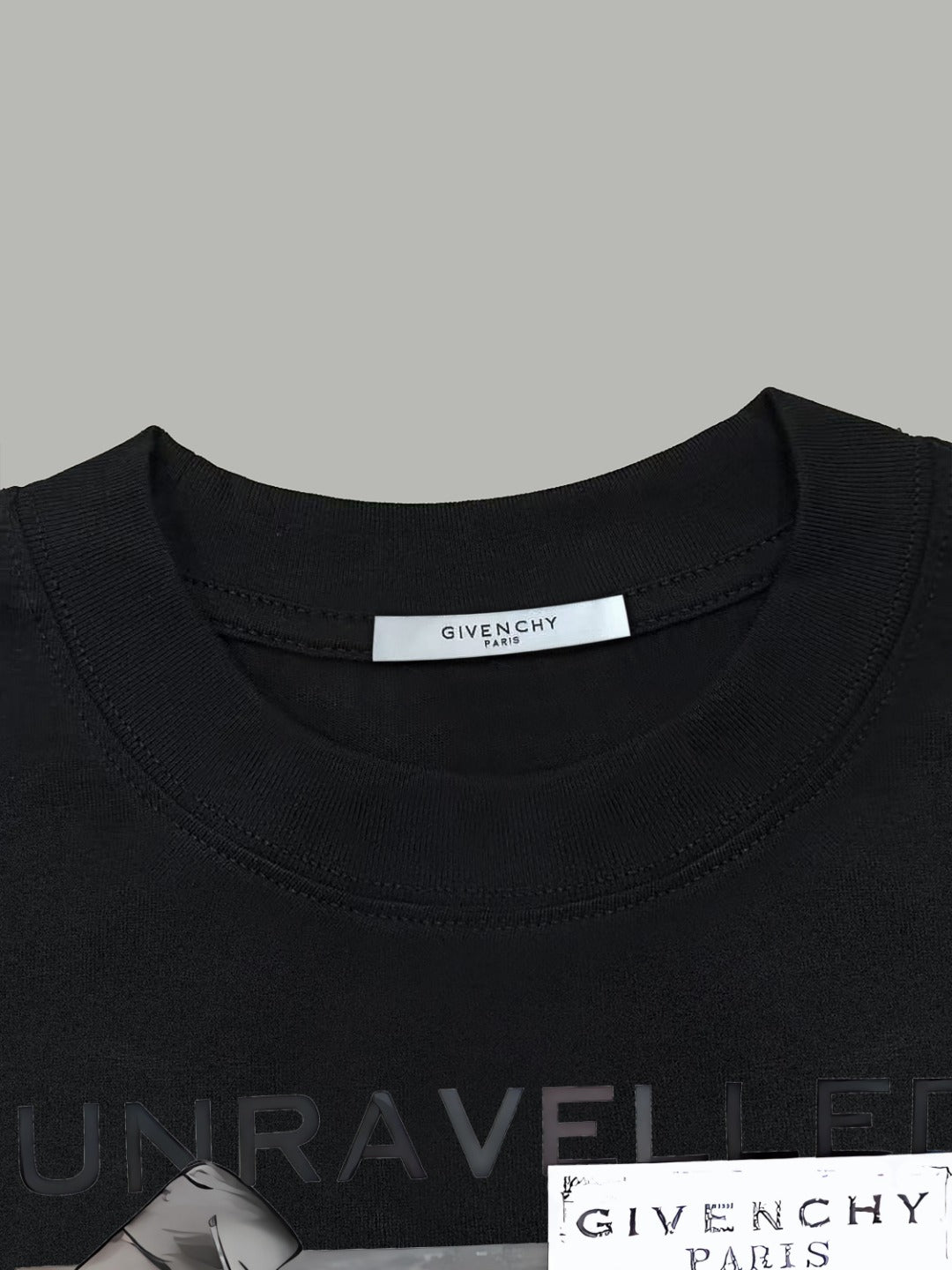 Black crewneck T-shirt close-up of collar and chest print