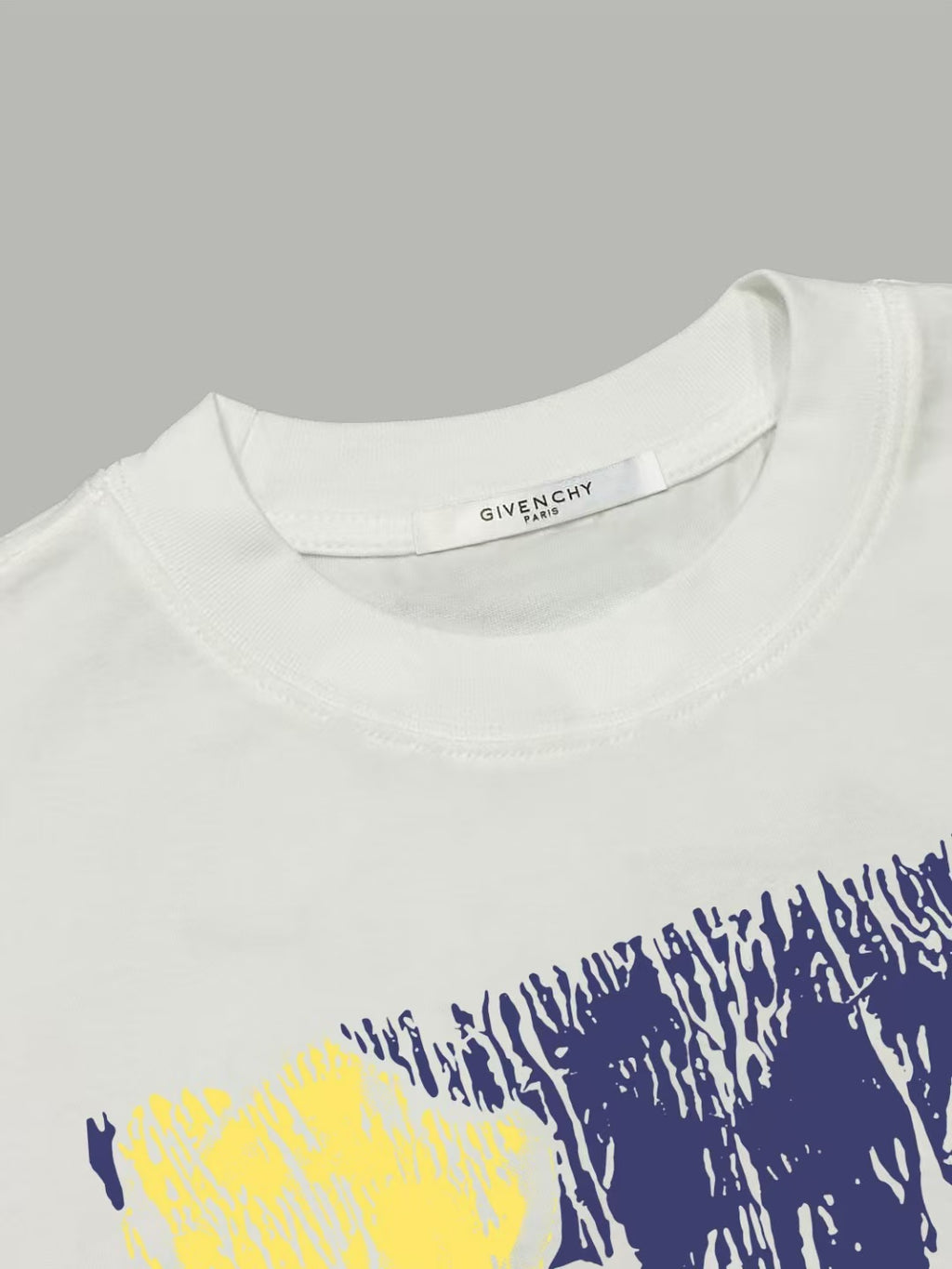 White Givenchy T-shirt with crew neck and blue/yellow graphic at chest