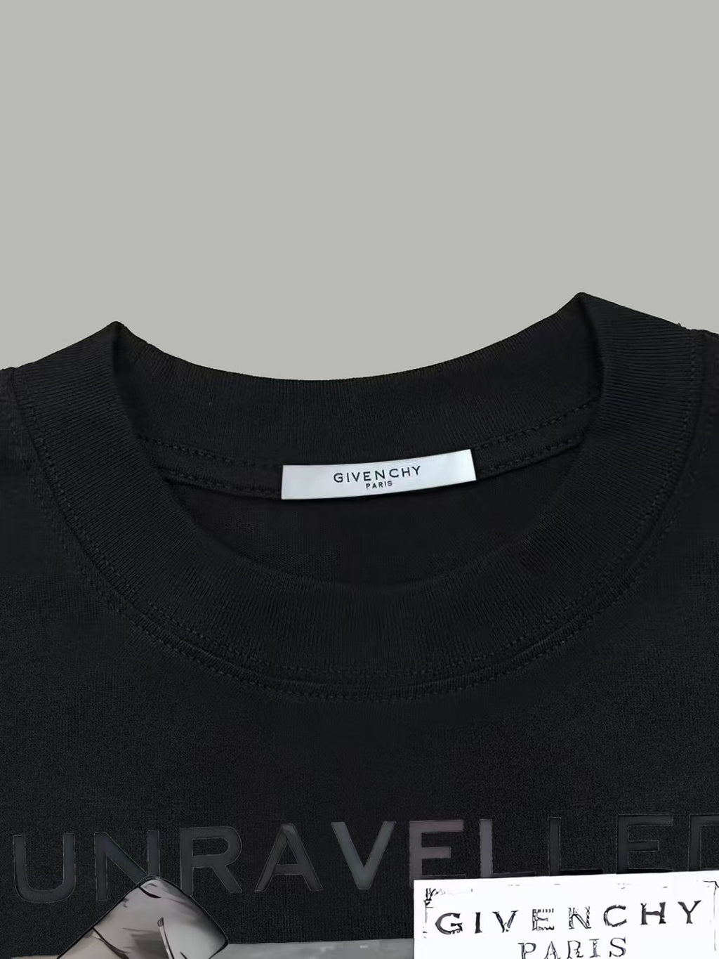 Black Givenchy T-shirt close-up of crew neck label and UNRAVELLED print