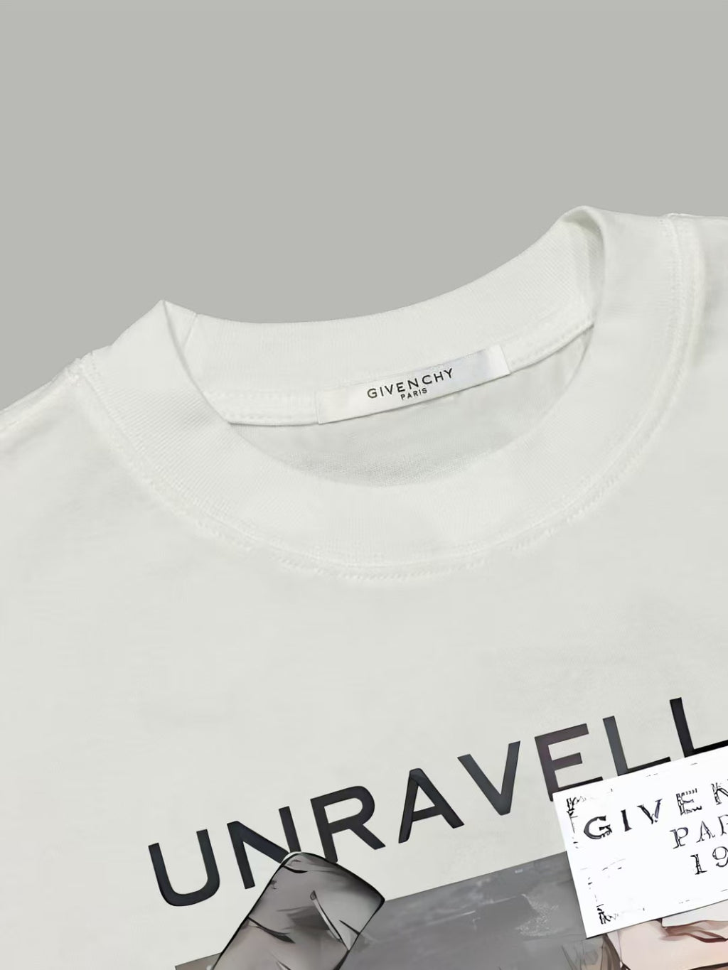White T-shirt neckline with black UNRAVELLED graphic detail