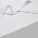 White polo shirt fabric weave close-up