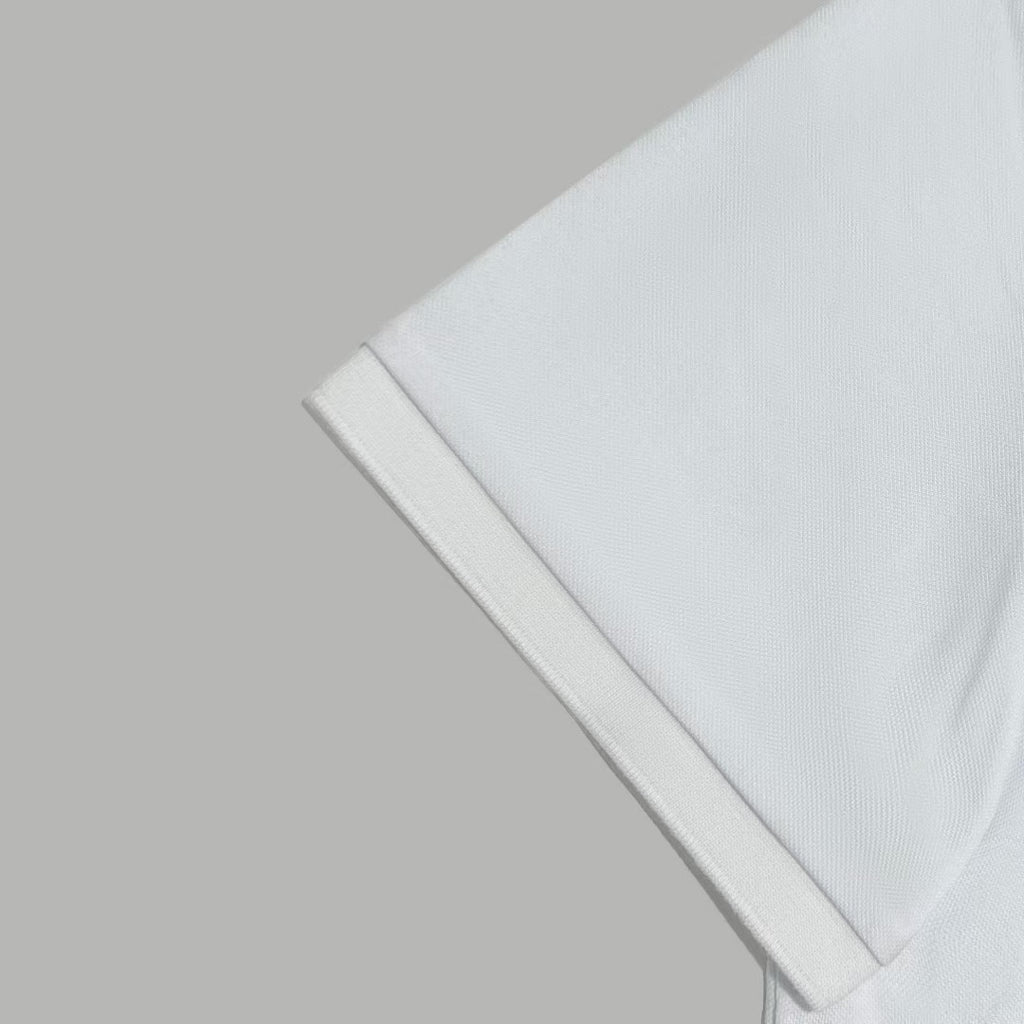 White polo shirt sleeve and shoulder seam close-up