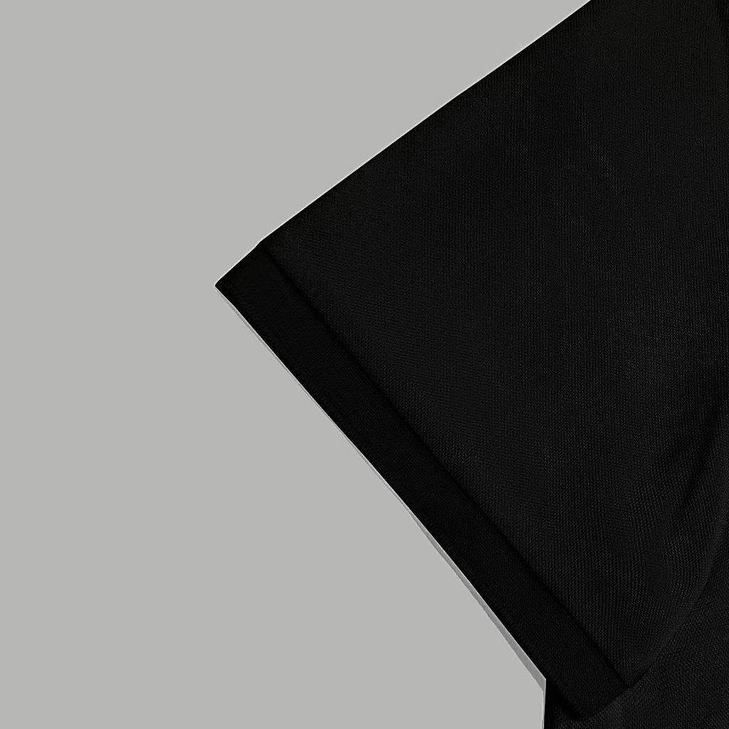Black Versace polo shirt sleeve and shoulder seam detail