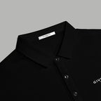 Black polo shirt collar and button placket, logo accent
