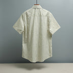 Light blue striped short-sleeve shirt back view with GG logo pattern