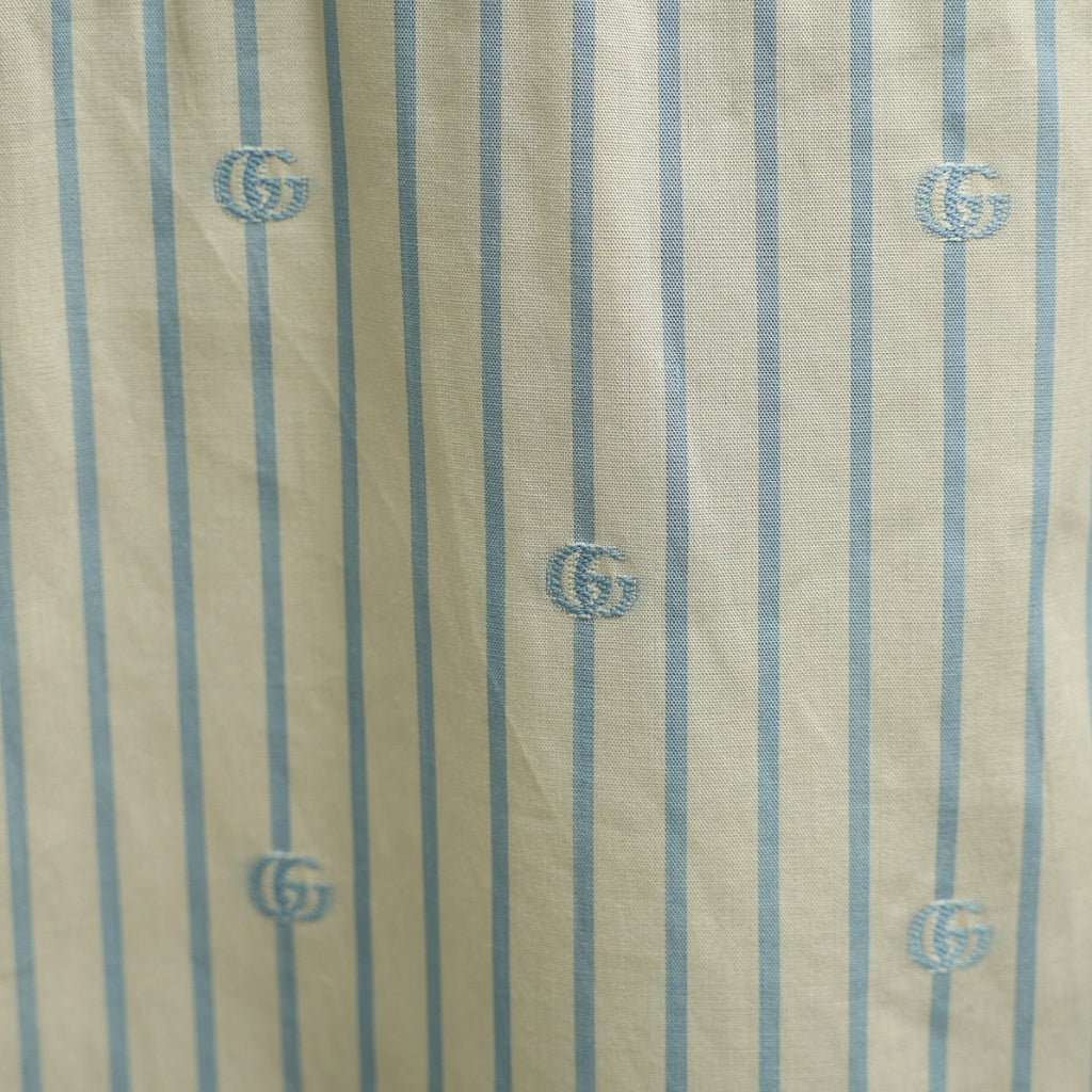 Gucci vertical striped fabric with GG logo motifs