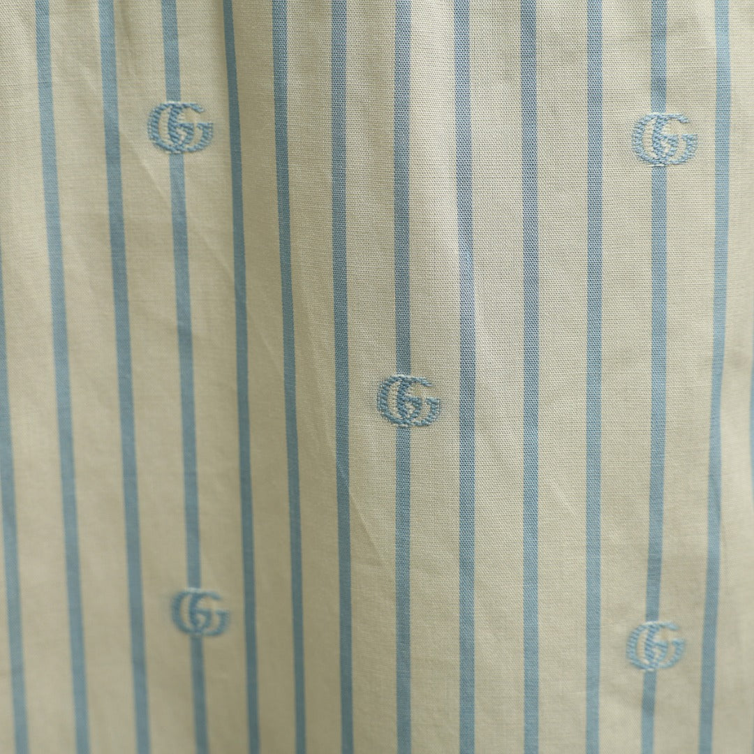 Gucci vertical striped fabric with GG logo motifs