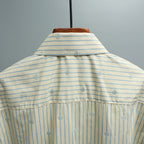 Gucci striped shirt with light blue logo print and buttoned back