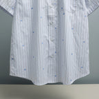 Short-sleeve striped button-up shirt front with central button placket