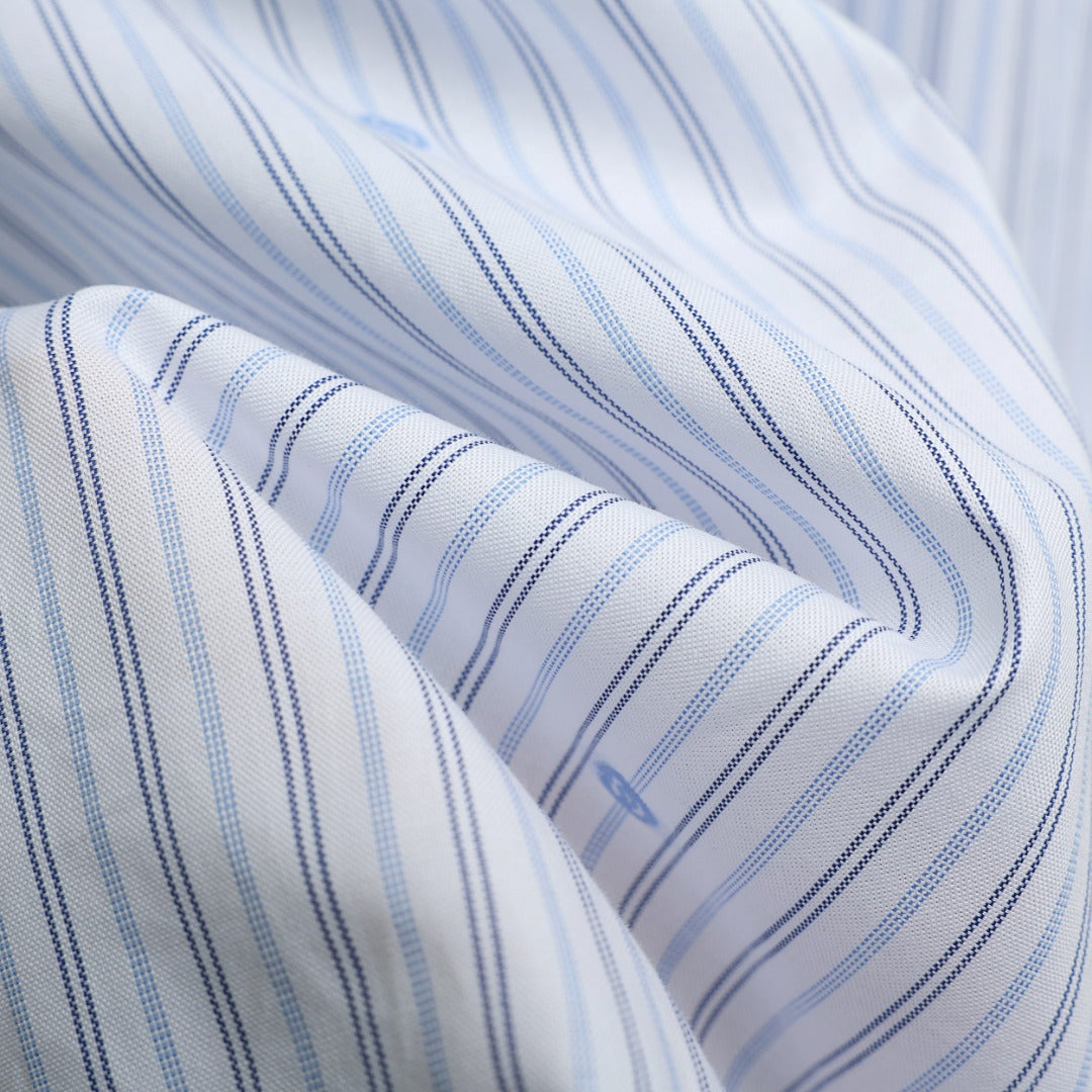 Short-sleeve shirt fabric close-up with white base and blue pinstripe weave