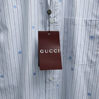 Short-sleeve striped shirt with chest pocket and hanging Gucci tag