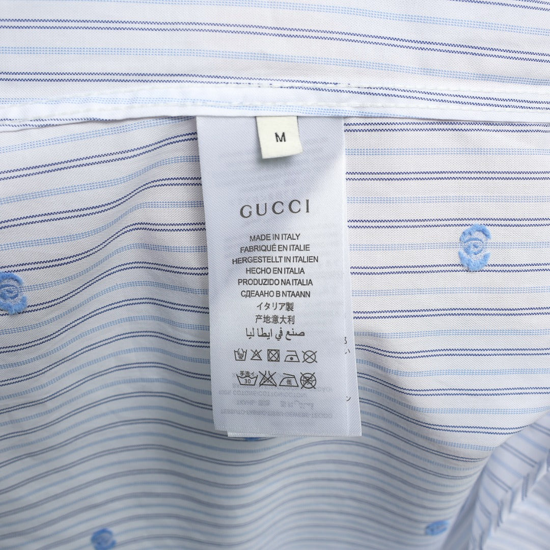 Short-sleeve shirt care label on striped fabric