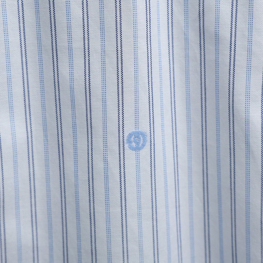 Gucci striped fabric close-up with blue emblem details