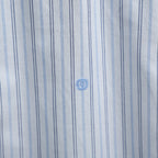 Gucci striped fabric close-up with blue emblem details