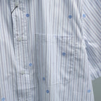 Short-sleeve button-up shirt chest pocket and front placket with buttons