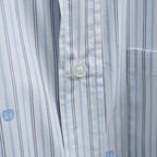 Short-sleeve striped shirt button detail with blue pinstripes