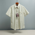 Light blue striped short-sleeve button-up shirt with small GG logo pattern