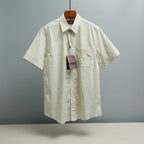 Light blue striped short-sleeve button-up shirt with small GG logo pattern
