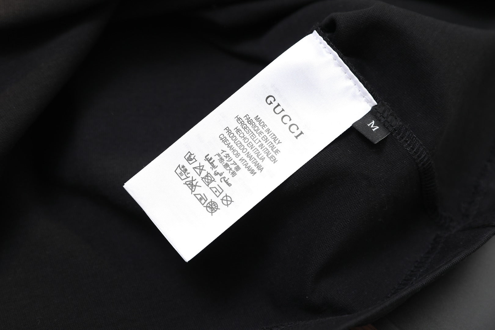 Black Gucci T-shirt care label on inside neck
