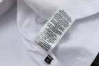 White T-shirt care label and printed size/brand text on inner neck
