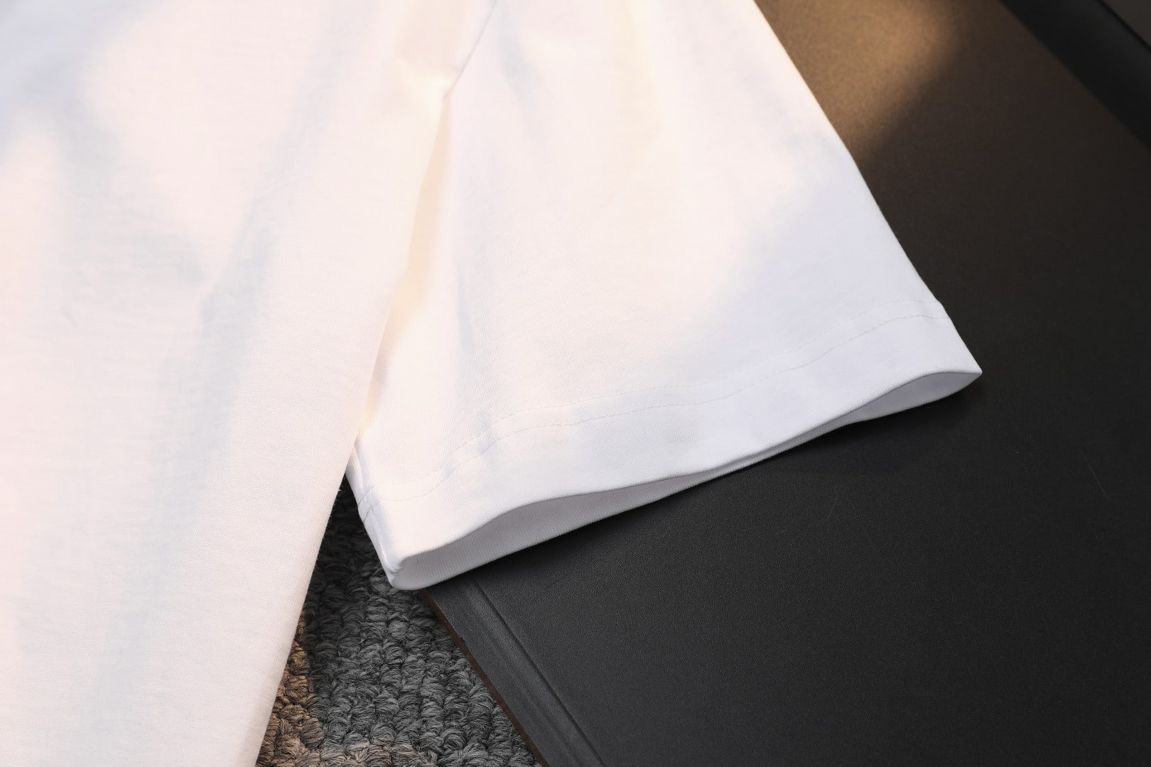 White Gucci T-shirt folded corner with visible sleeve hem