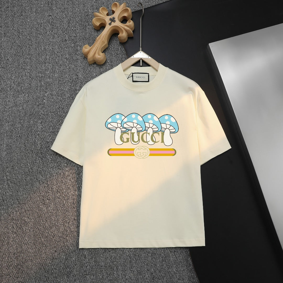 Cream T-shirt with blue bow graphic and Gucci logo on the front