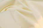 Cream T-shirt fabric drape close-up
