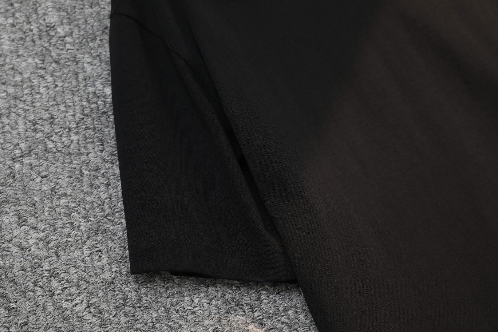 Black T-shirt side view with straight hem