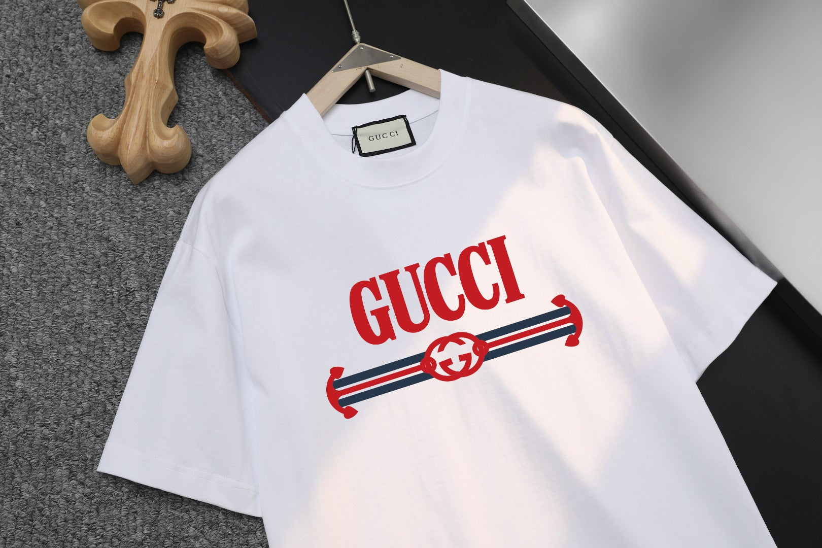 White Gucci T-shirt with large red Gucci logo and striped emblem, crew neck