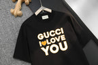Black Gucci T-shirt with yellow “GUCCI I LOVE YOU” graphic on chest