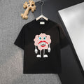 Black short-sleeve T-shirt with pink cartoon face graphic on front