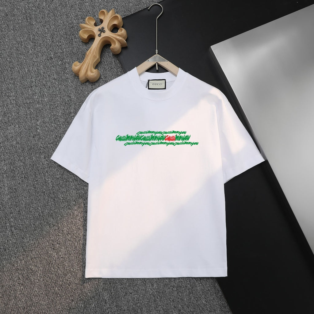 White short-sleeve T-shirt with green logo graphic on chest, Gucci label at collar