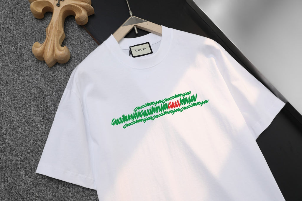 White short-sleeve T-shirt with green logo graphic, crew neck with inner Gucci tag
