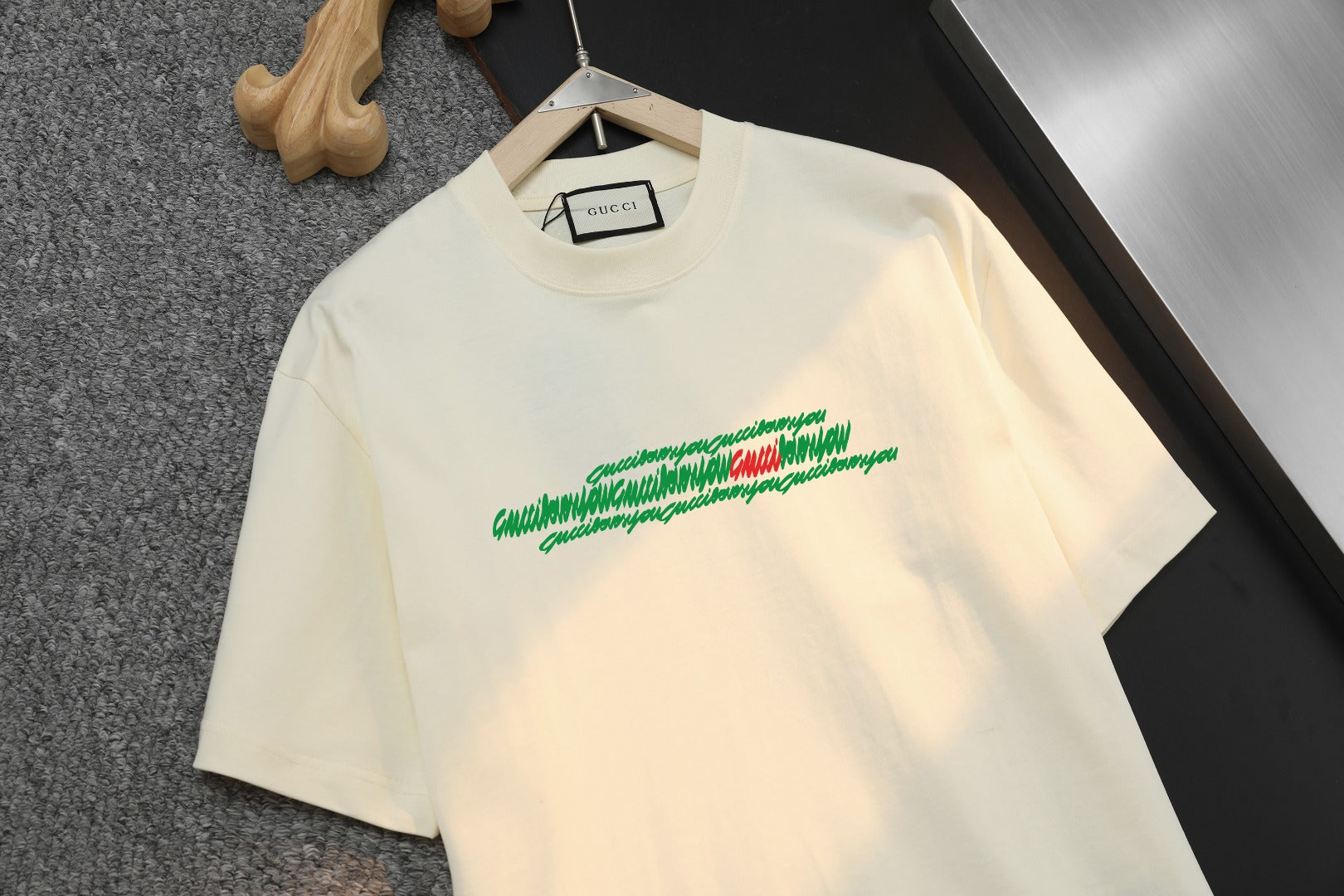 Gucci cream T-shirt with green and red script-style front logo