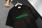 Black short-sleeve T-shirt with green logo graphic on chest