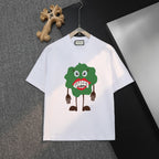 White Gucci short-sleeve T-shirt on hanger, front graphic with green character face