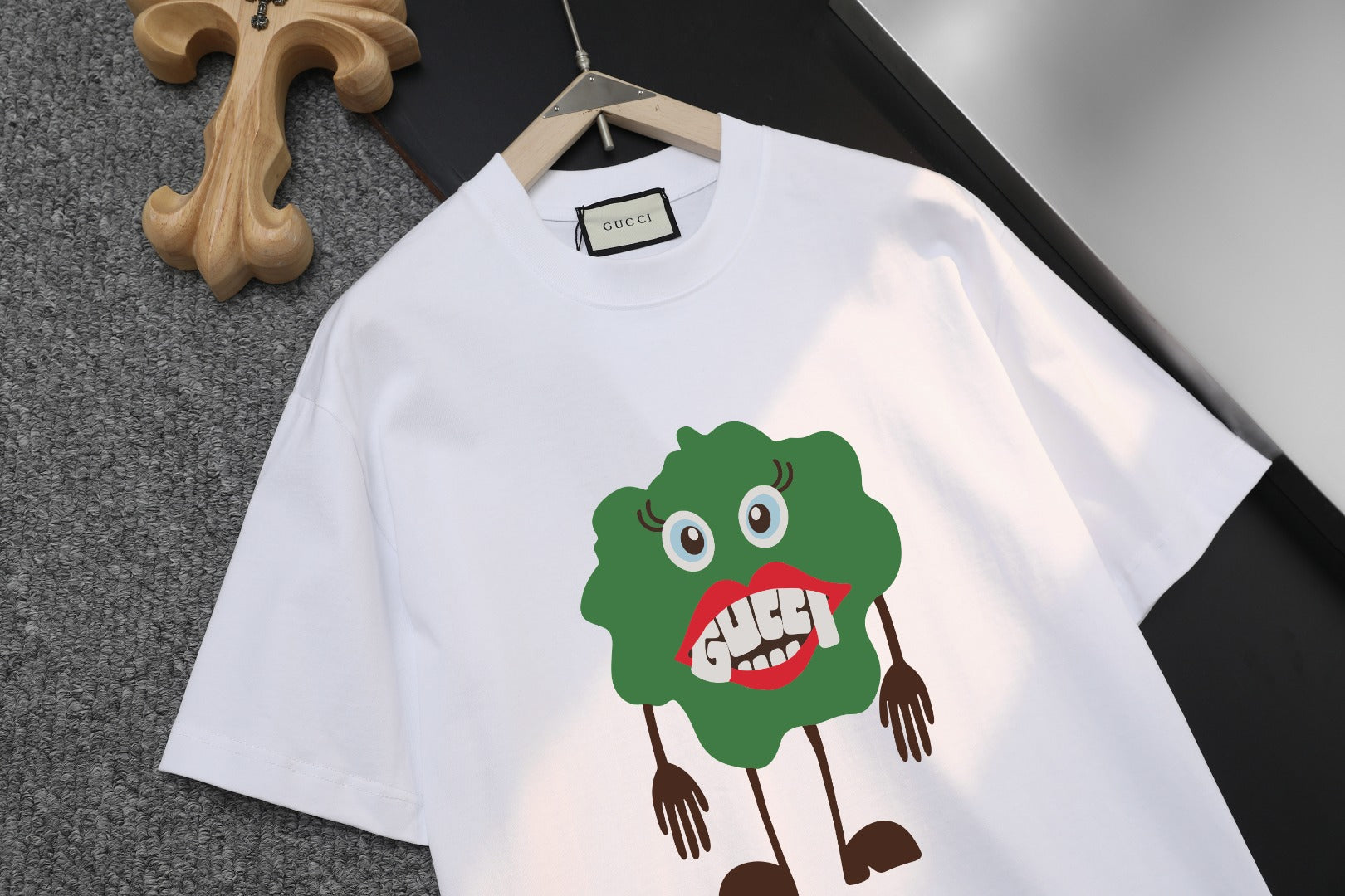 White Gucci short-sleeve T-shirt on hanger, large front cartoon character print