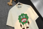 Cream Gucci short-sleeve T-shirt with large green character graphic detail