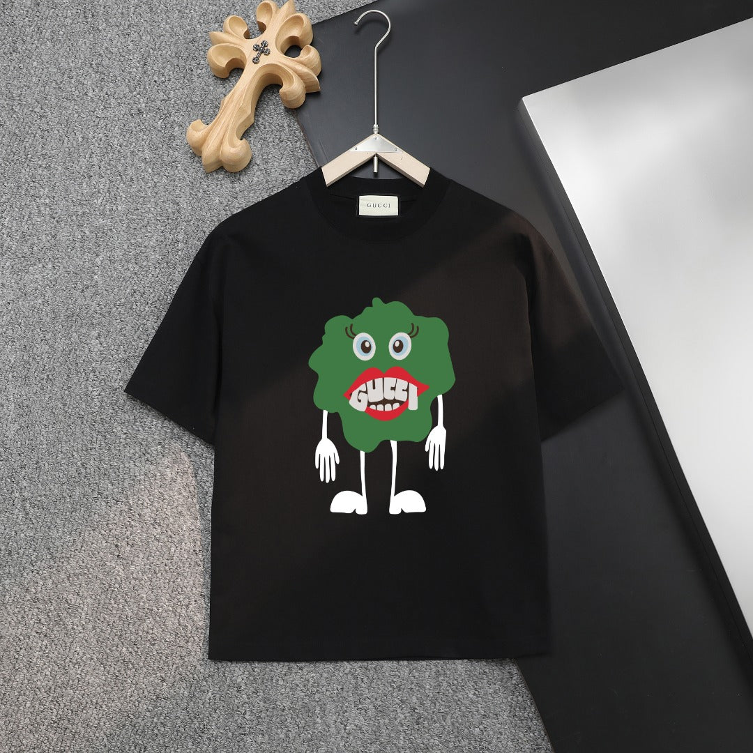 Black Gucci T-shirt with green cartoon monster graphic on chest