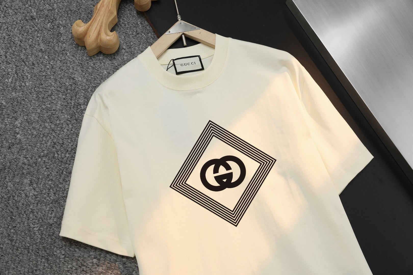 Cream Gucci T-shirt with GG diamond logo, close-up front view