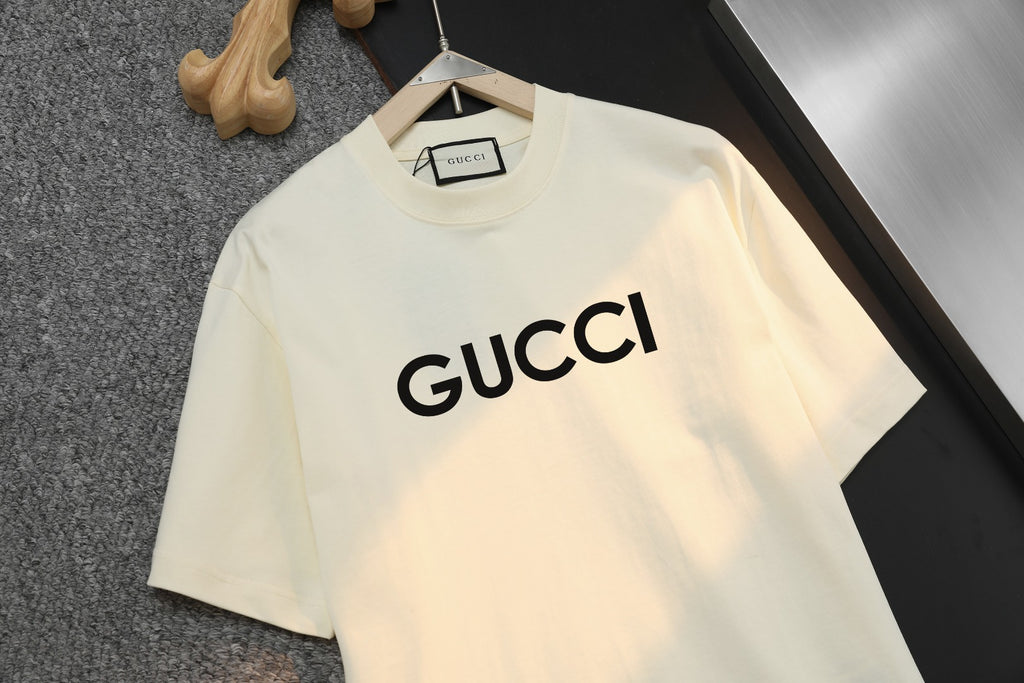 Cream short-sleeve T-shirt with large GUCCI wordmark on chest