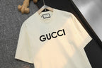 Cream short-sleeve T-shirt with large GUCCI wordmark on chest