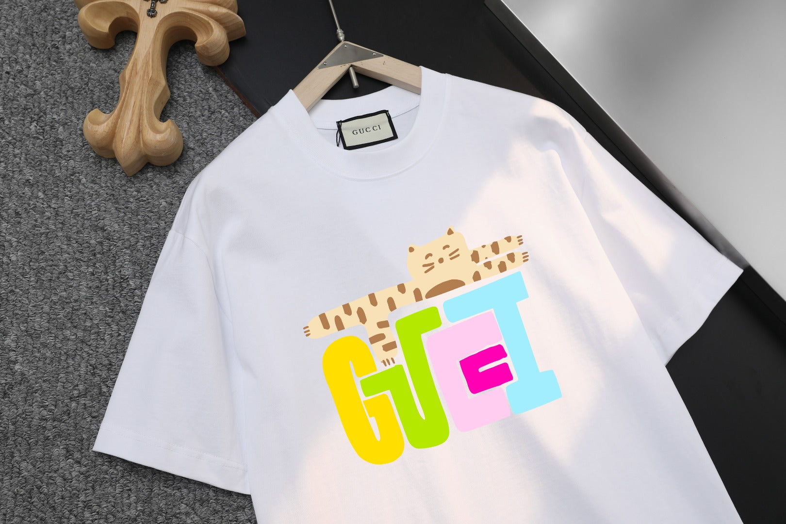 White Gucci T-shirt close-up of colorful front logo graphic