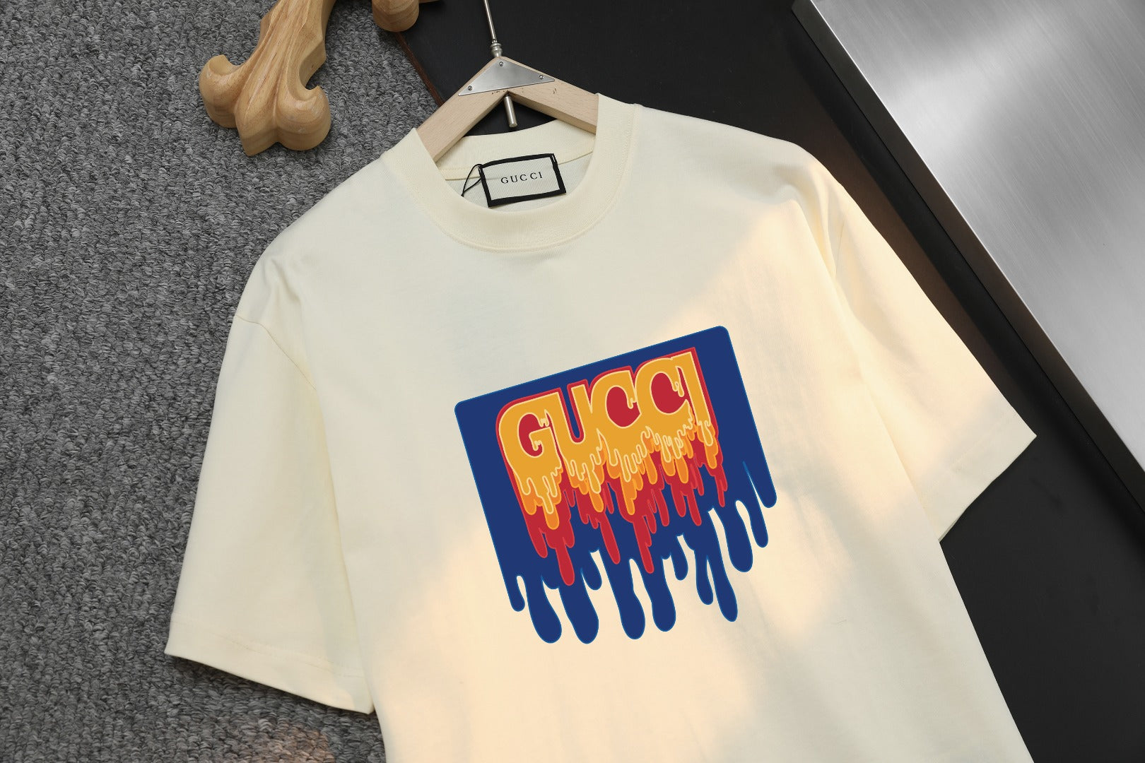 Cream short-sleeve T-shirt with large multicolor logo print on front