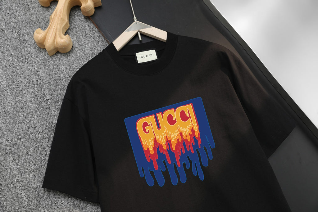 Black Gucci short-sleeve shirt with large colorful dripping G logo on front