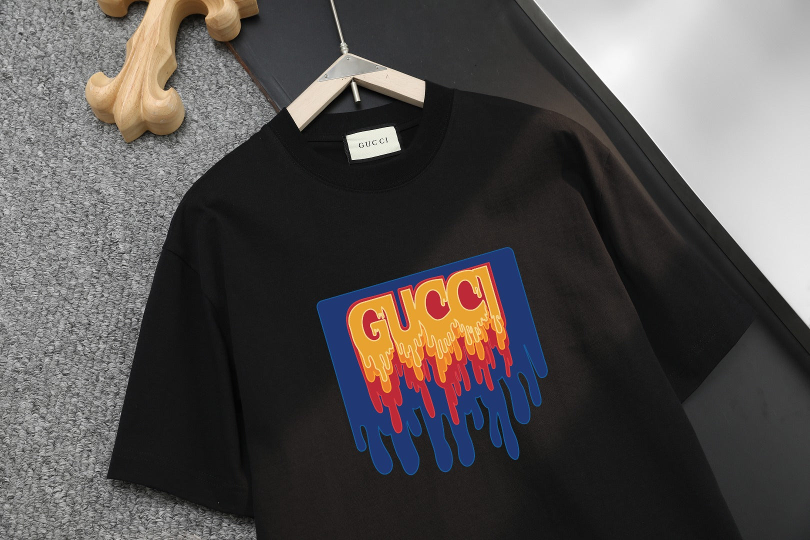Black Gucci short-sleeve shirt with large colorful dripping G logo on front