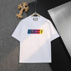 White short-sleeve T-shirt with multicolor GUCCI logo on front