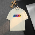 Cream Gucci T-shirt with colorful logo on chest, crew neck short sleeves.